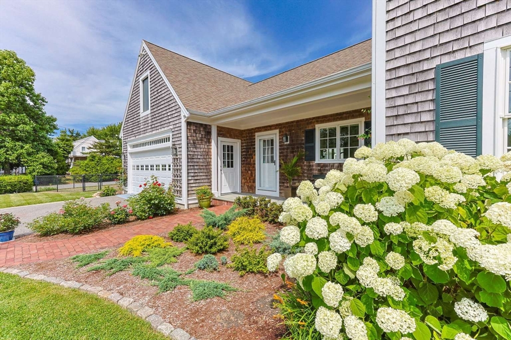 110 Commerce Road Barnstable, MA 02630 - Photo 5 of 41 a view of a house with garden