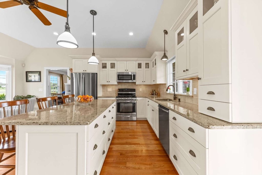 110 Commerce Road Barnstable, MA 02630 - Photo 10 of 41 a large kitchen with granite countertop lots of counter space and stainless steel appliances
