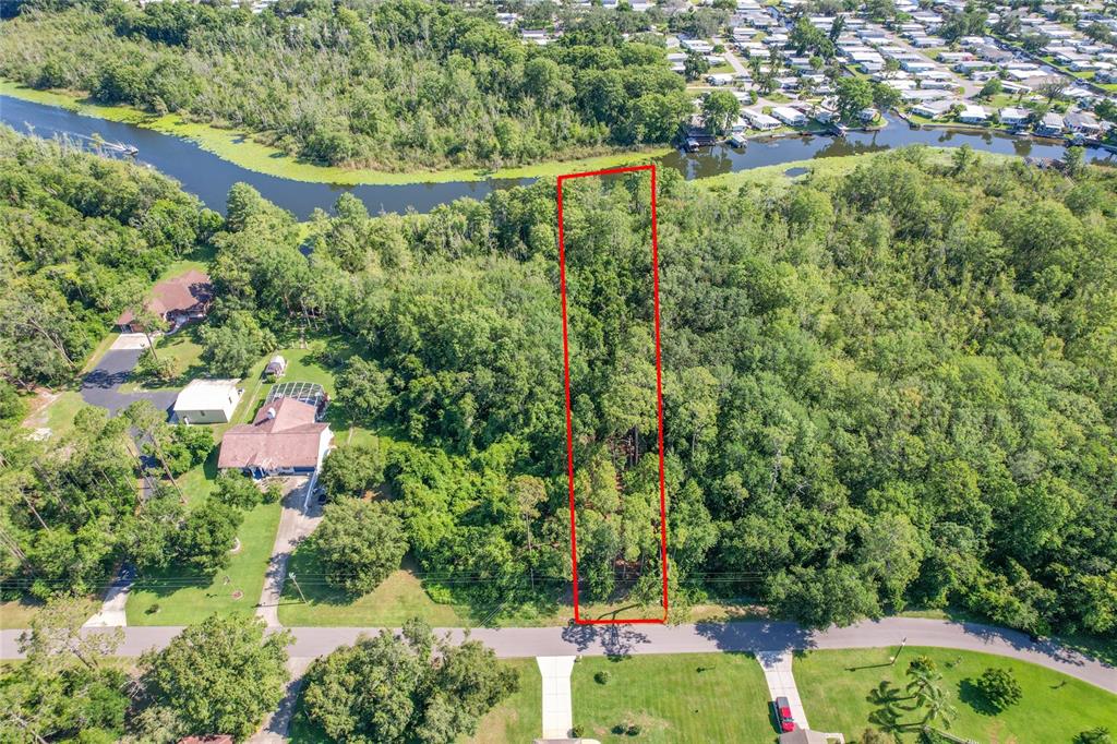 Creek Road Leesburg, FL 34788 - Photo 3 of 19 an aerial view of residential house with outdoor space and trees all around
