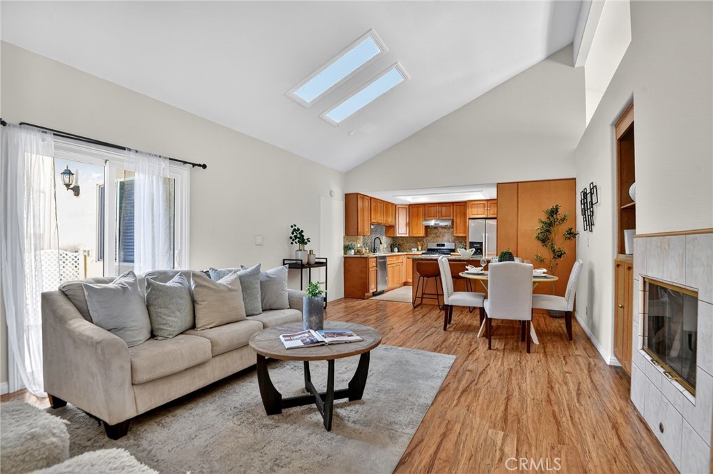 20122 Candleflame Court Walnut, CA 91789 - Photo 11 of 61 a living room with furniture dining table a fireplace and wooden floor