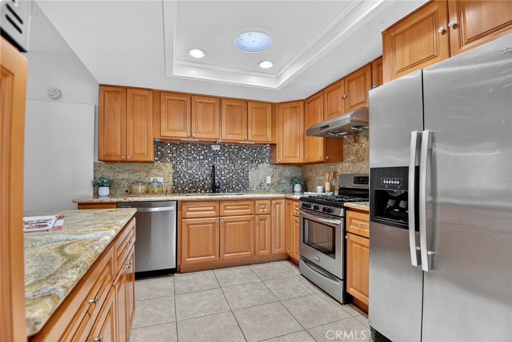 20122 Candleflame Court Walnut, CA 91789 - Photo 15 of 61 a kitchen with a sink window and cabinets
