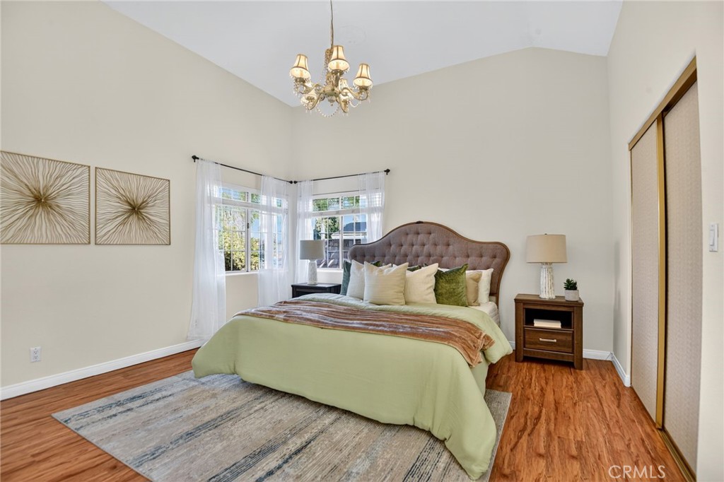 20122 Candleflame Court Walnut, CA 91789 - Photo 17 of 61 a bedroom with a bed and wooden floor