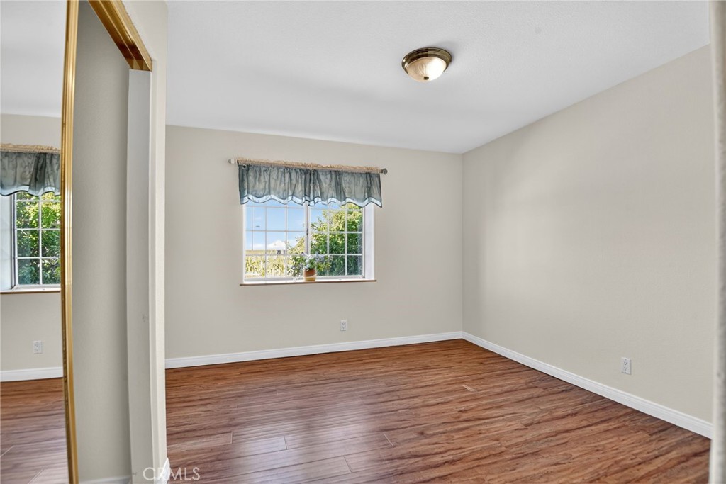 20122 Candleflame Court Walnut, CA 91789 - Photo 26 of 61 a view of an empty room with wooden floor and a window