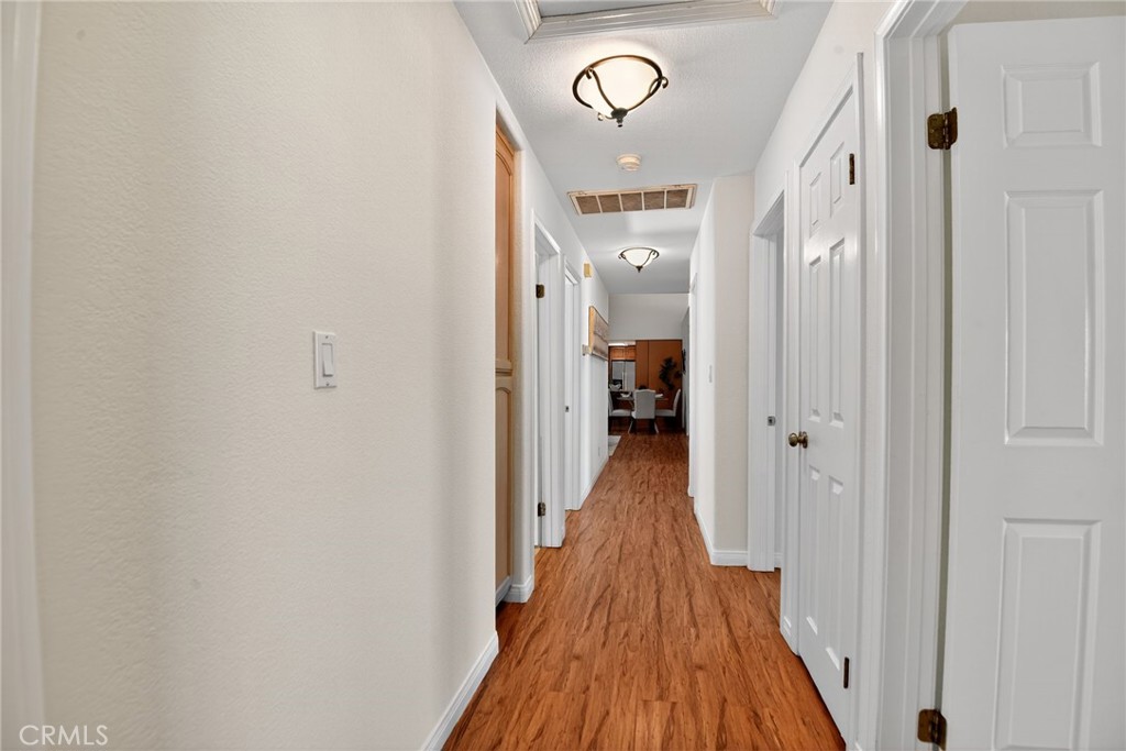 20122 Candleflame Court Walnut, CA 91789 - Photo 28 of 61 a view of a hallway with wooden floor