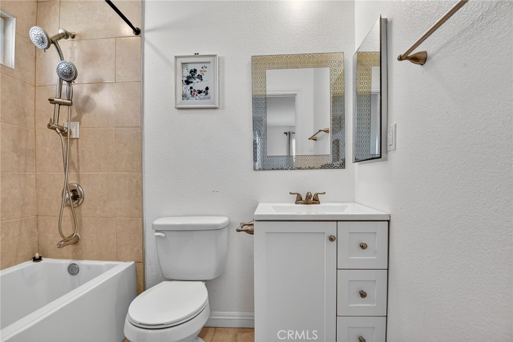 20122 Candleflame Court Walnut, CA 91789 - Photo 43 of 61 a bathroom with a toilet a sink a bath tub and mirror