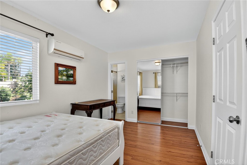 20122 Candleflame Court Walnut, CA 91789 - Photo 50 of 61 a bedroom with wooden floor and window