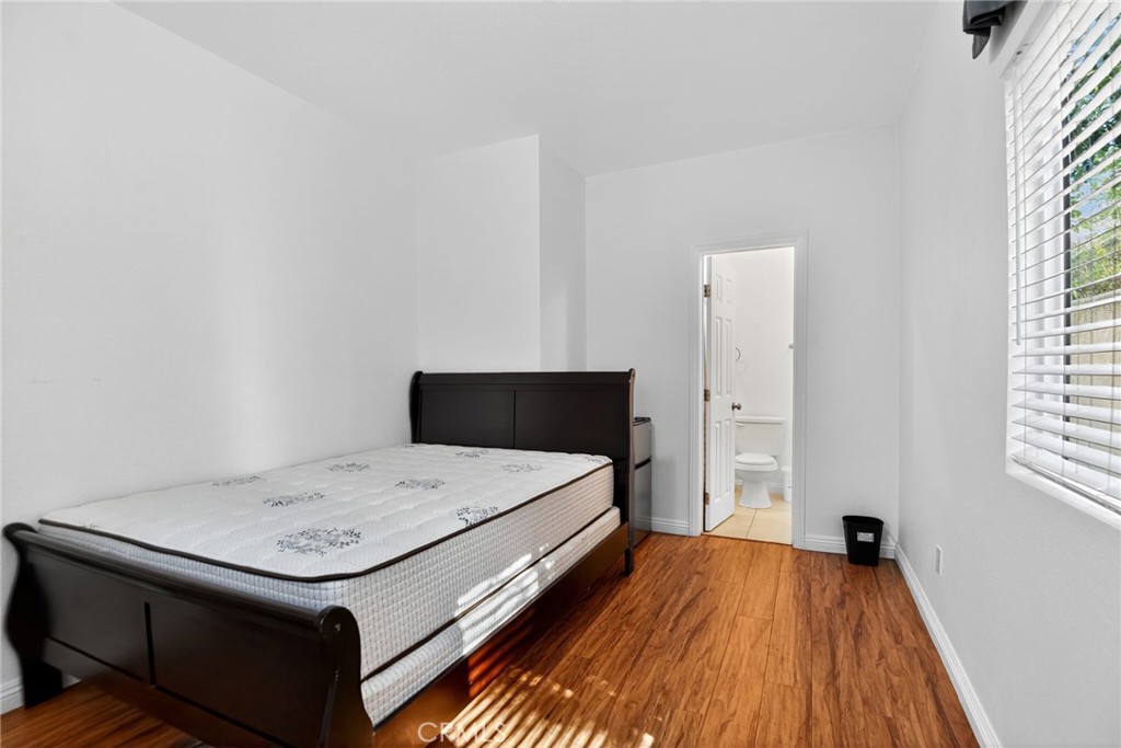 20122 Candleflame Court Walnut, CA 91789 - Photo 54 of 61 a bedroom with a bed and a dresser next to a window