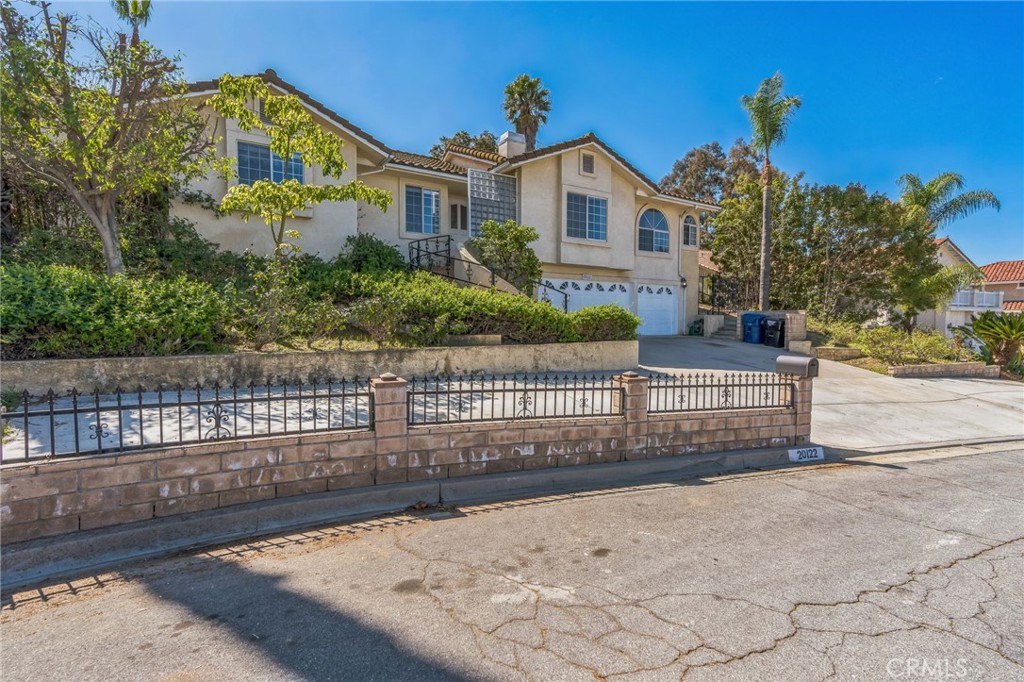 20122 Candleflame Court Walnut, CA 91789 - Photo 56 of 61 a view of a house with a small yard and large trees