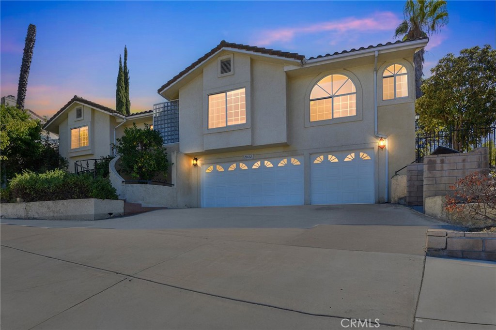 20122 Candleflame Court Walnut, CA 91789 - Photo 57 of 61 a front view of a house with a yard and garage