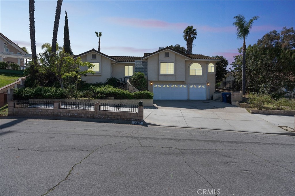 20122 Candleflame Court Walnut, CA 91789 - Photo 58 of 61 a front view of a house with a yard and garage