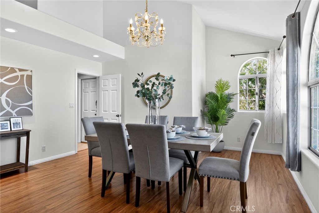 20122 Candleflame Court Walnut, CA 91789 - Photo 6 of 61 a view of a dining room with furniture wooden floor and a chandelier