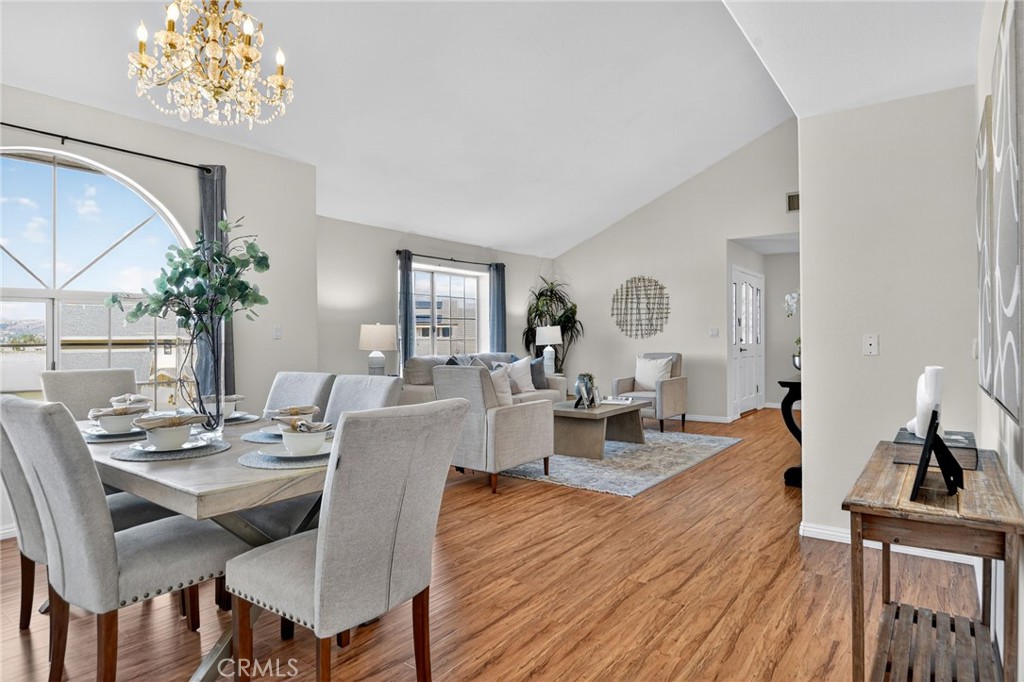 20122 Candleflame Court Walnut, CA 91789 - Photo 7 of 61 a view of a dining room with furniture window and wooden floor