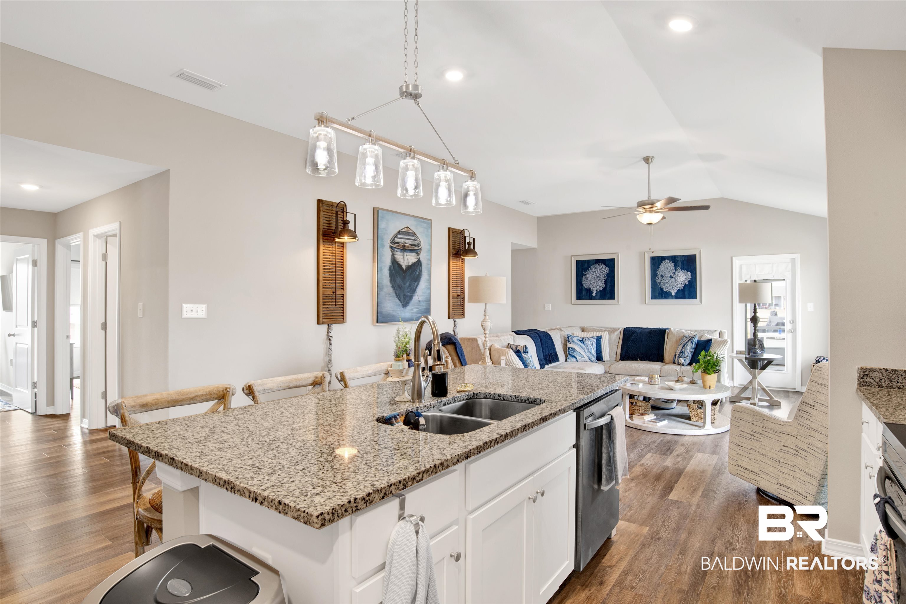 3097 Ingrid Lane Foley, AL 36535 - Photo 17 of 38 Kitchen featuring decorative light fixtures, dishwasher, an island with sink, sink, and white cabinets