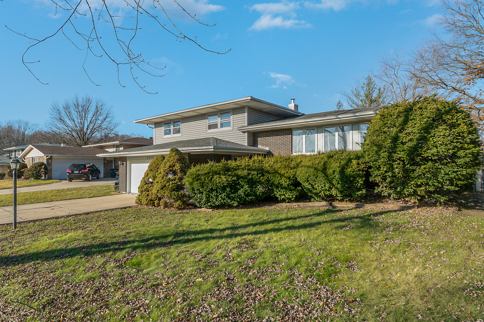 2832 193rd Street Lansing, IL 60438 - Photo 2 of 25 a front view of a house with a yard