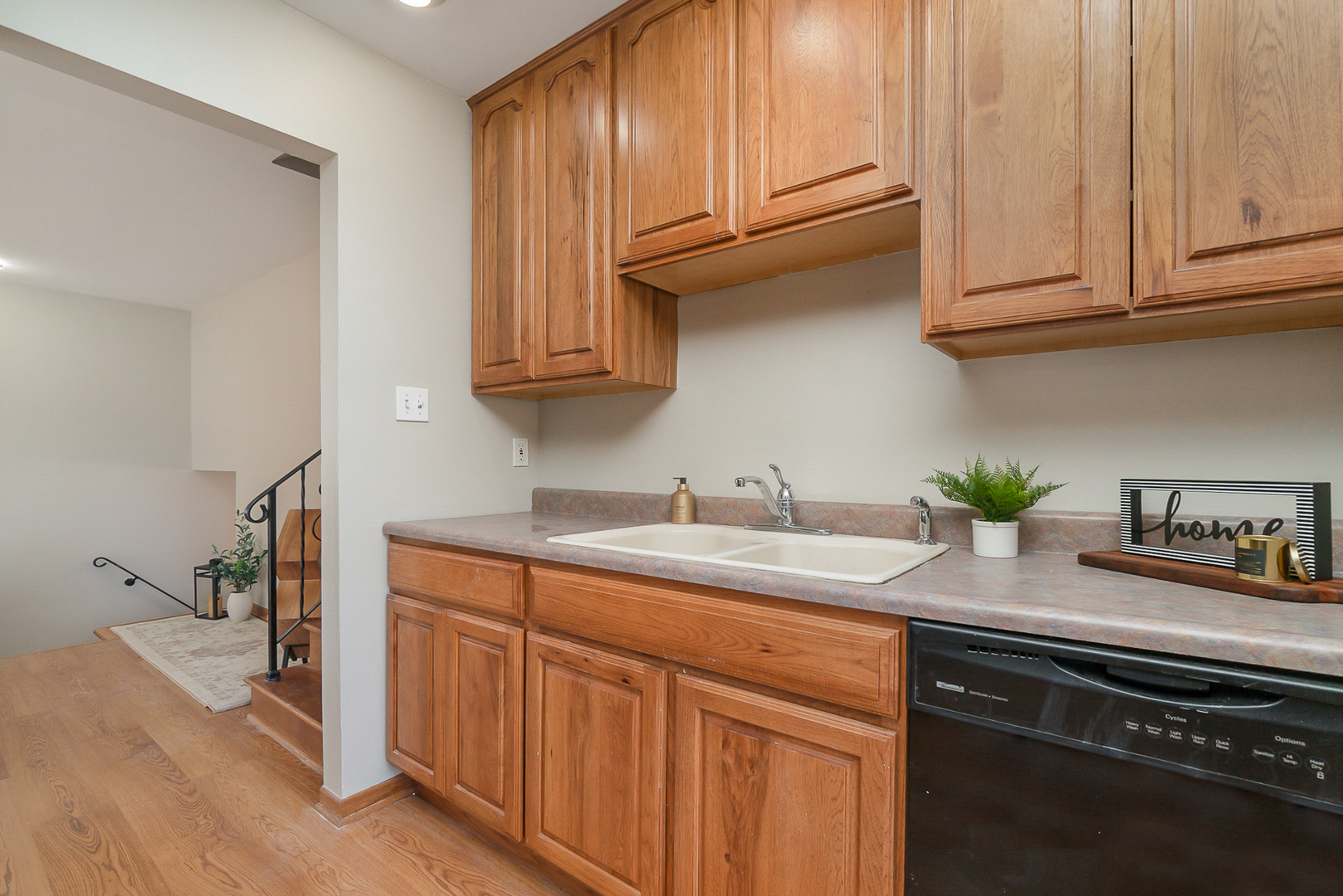 2832 193rd Street Lansing, IL 60438 - Photo 12 of 25 a kitchen with stainless steel appliances granite countertop a sink a stove cabinets and a counter top space