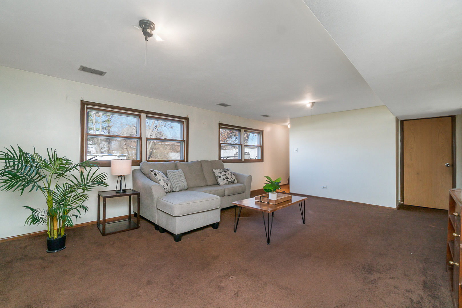 2832 193rd Street Lansing, IL 60438 - Photo 15 of 25 a living room with furniture and a potted plant