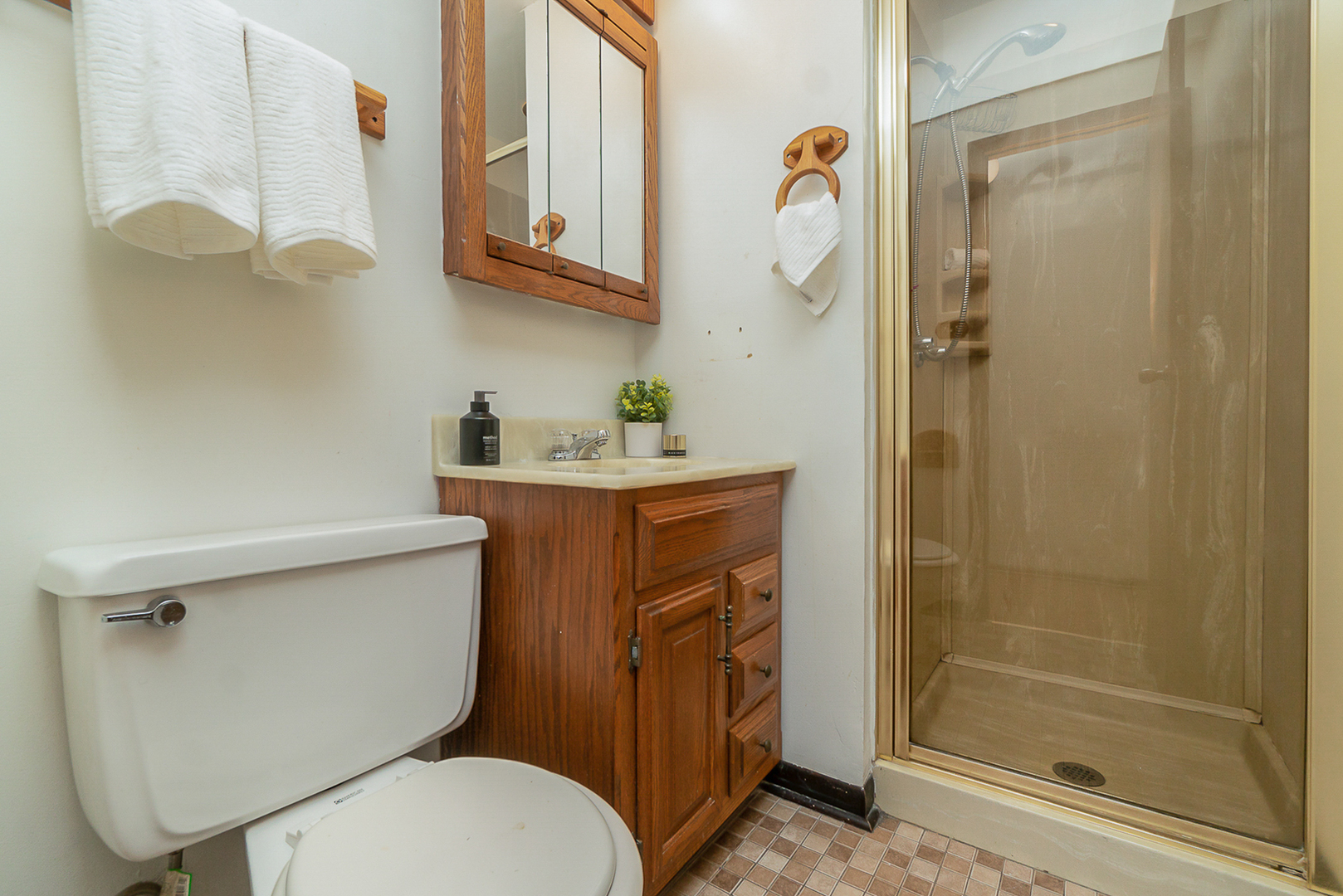 2832 193rd Street Lansing, IL 60438 - Photo 17 of 25 a bathroom with a sink a toilet and shower