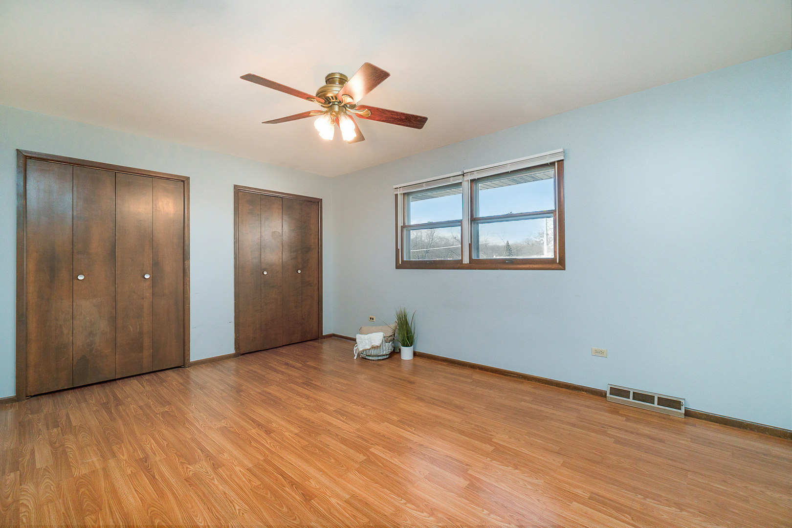 2832 193rd Street Lansing, IL 60438 - Photo 18 of 25 a view of an empty room with window and wooden floor