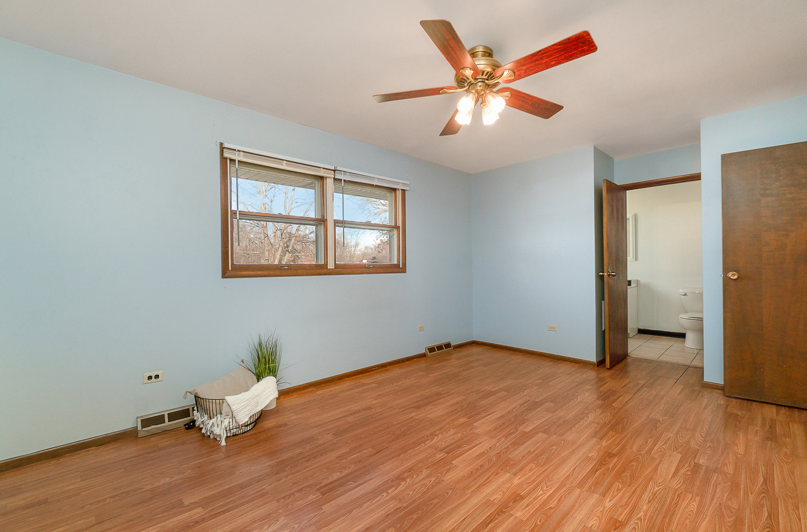 2832 193rd Street Lansing, IL 60438 - Photo 19 of 25 an empty room with wooden floor and a ceiling fan