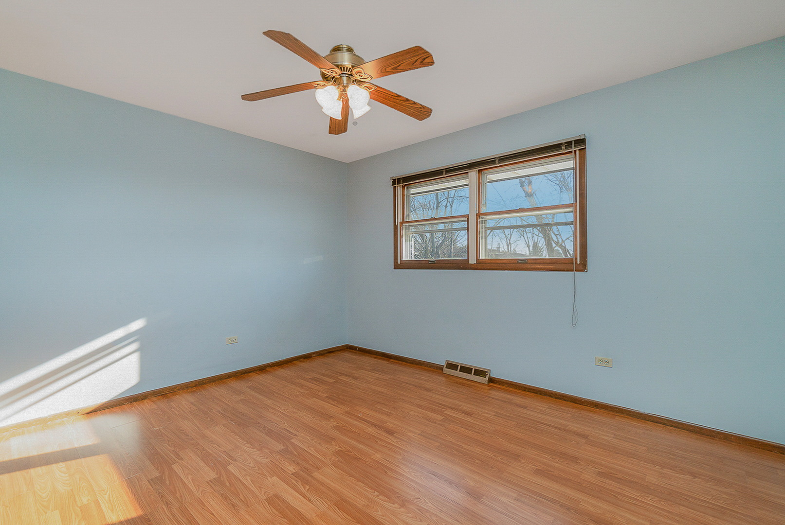 2832 193rd Street Lansing, IL 60438 - Photo 20 of 25 wooden floor in an empty room with a window