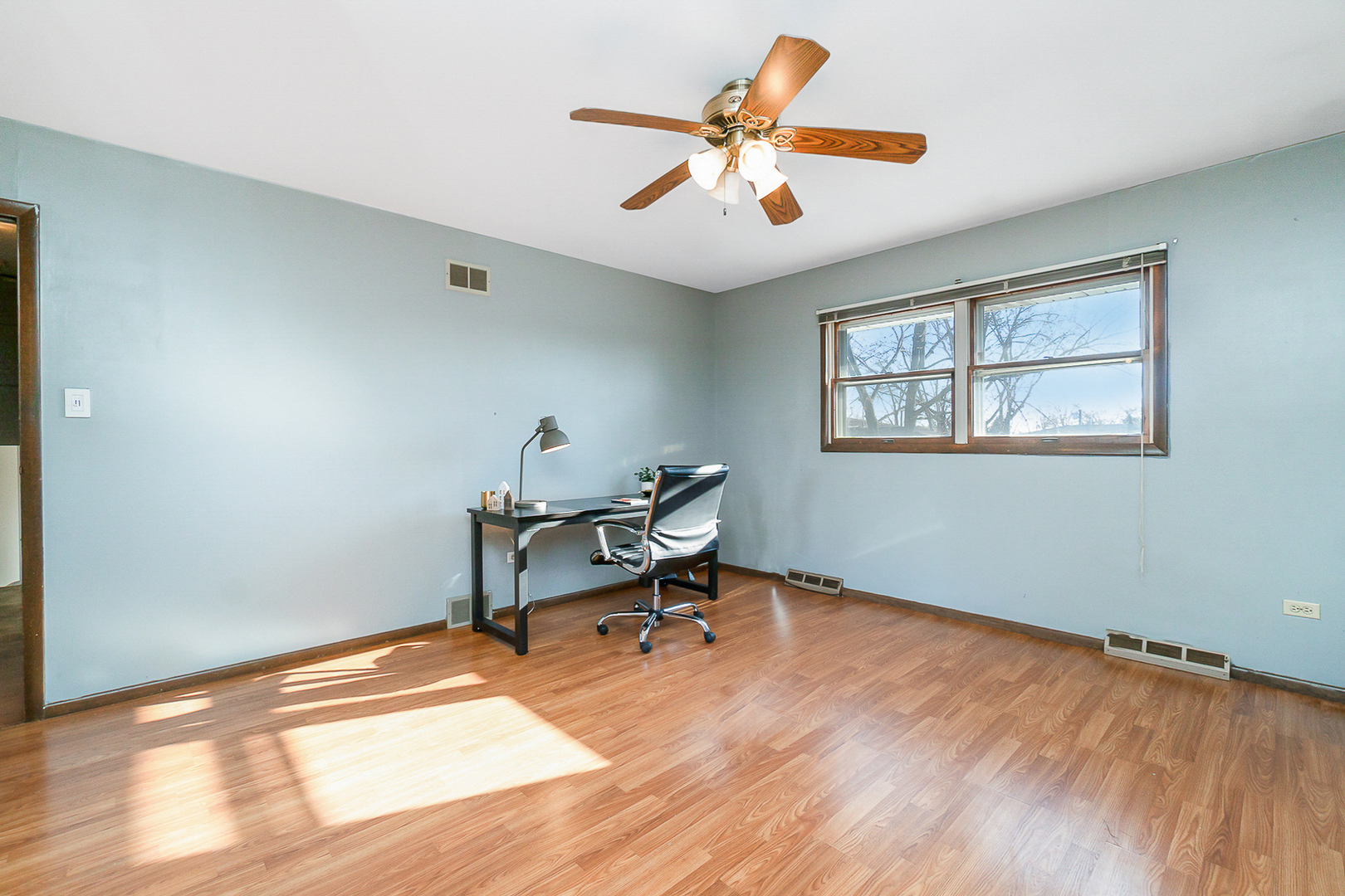 2832 193rd Street Lansing, IL 60438 - Photo 21 of 25 a view of a workspace with wooden floor and a window