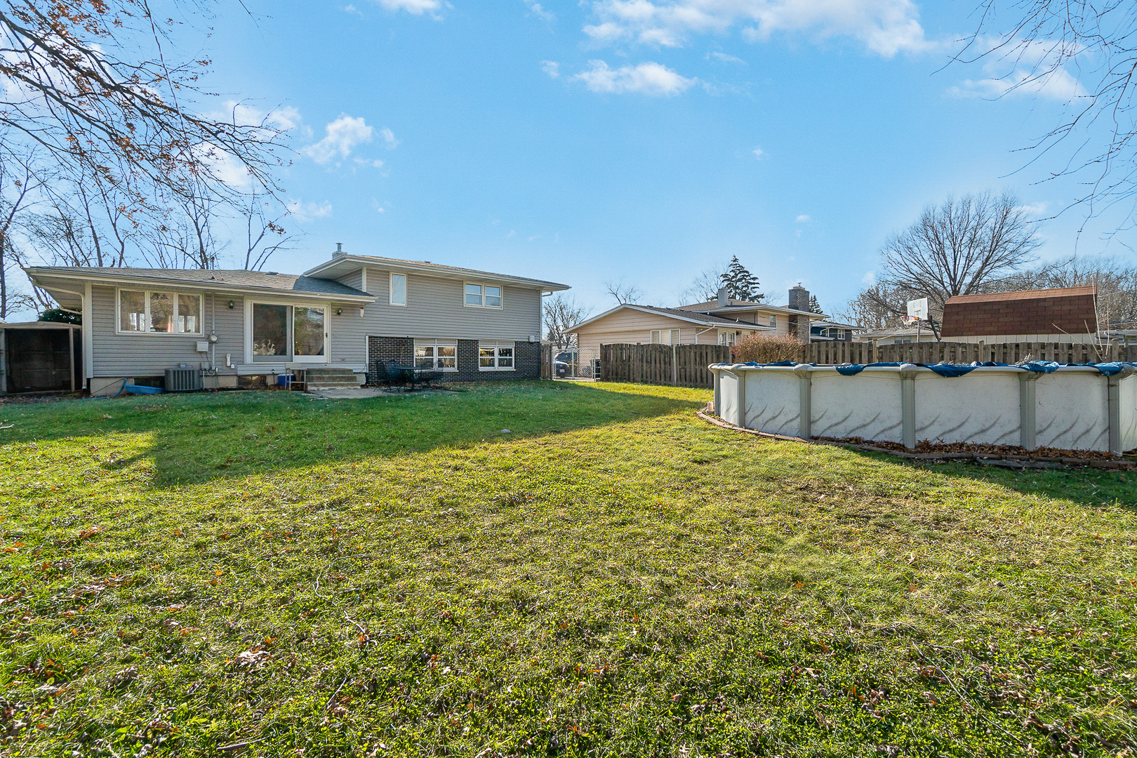 2832 193rd Street Lansing, IL 60438 - Photo 24 of 25 a view of a house with a big yard and large tree