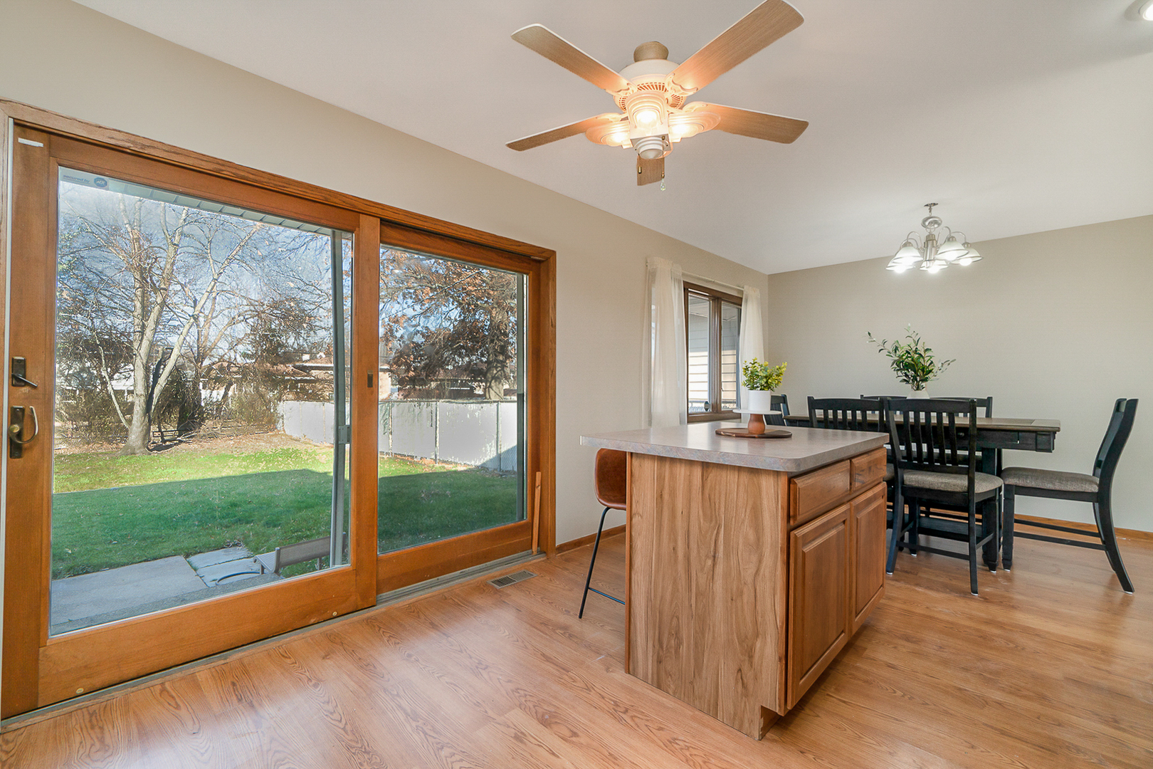 2832 193rd Street Lansing, IL 60438 - Photo 10 of 25 a view of a kitchen with furniture a livingroom and wooden floor