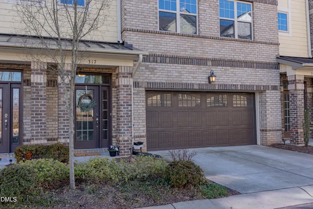 a front view of a building with garage