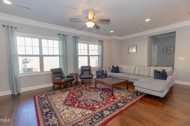 a living room with furniture rug and window