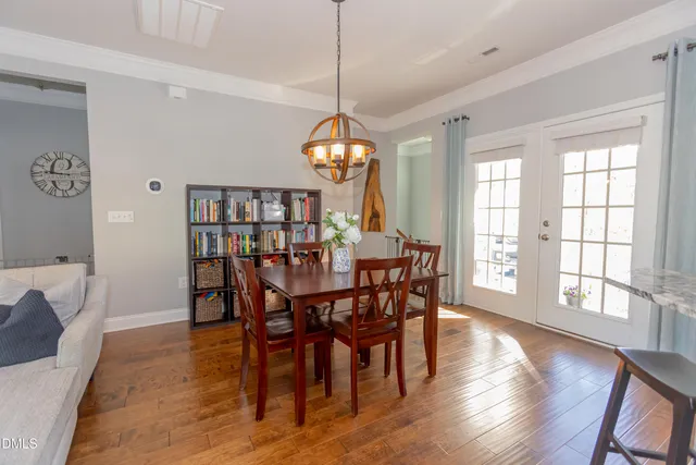 a dining room with furniture window wooden floor