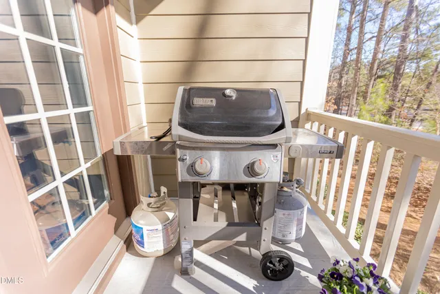 a large bed sitting in a bedroom next to a window
