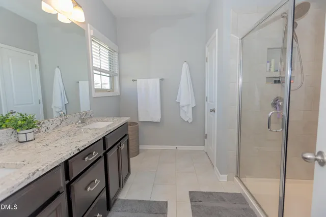 a en suite bathroom with a glass shower door