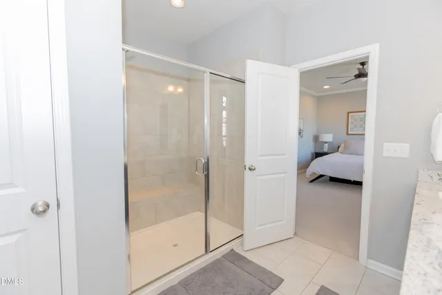 a bathroom with a toilet a sink and shower