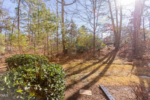 a view of a brick house with a door and wooden floor