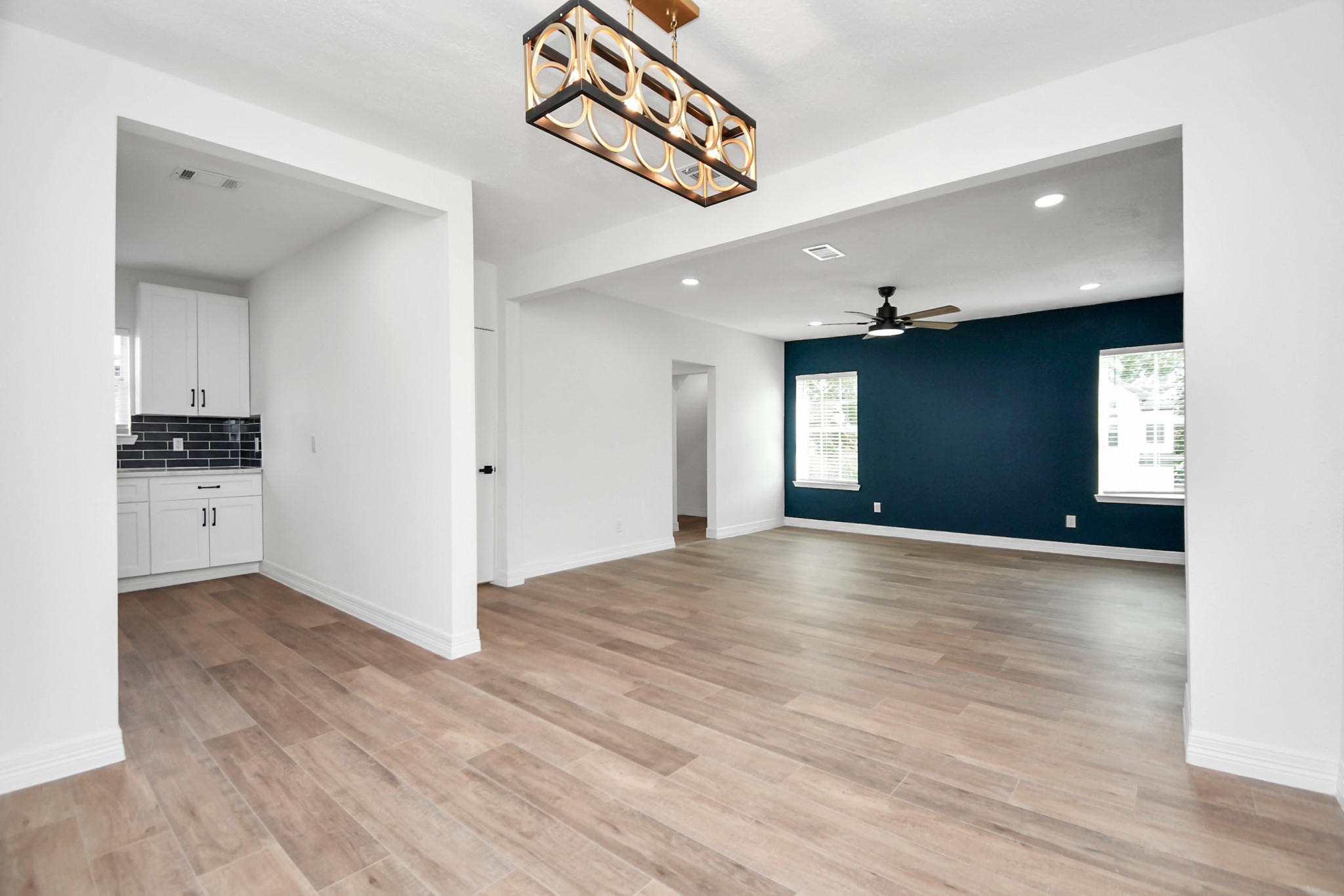 2812 Truxillo Street, Unit B Houston, TX 77004 - Photo 1 of 32 a view of an empty room and window and wooden floor