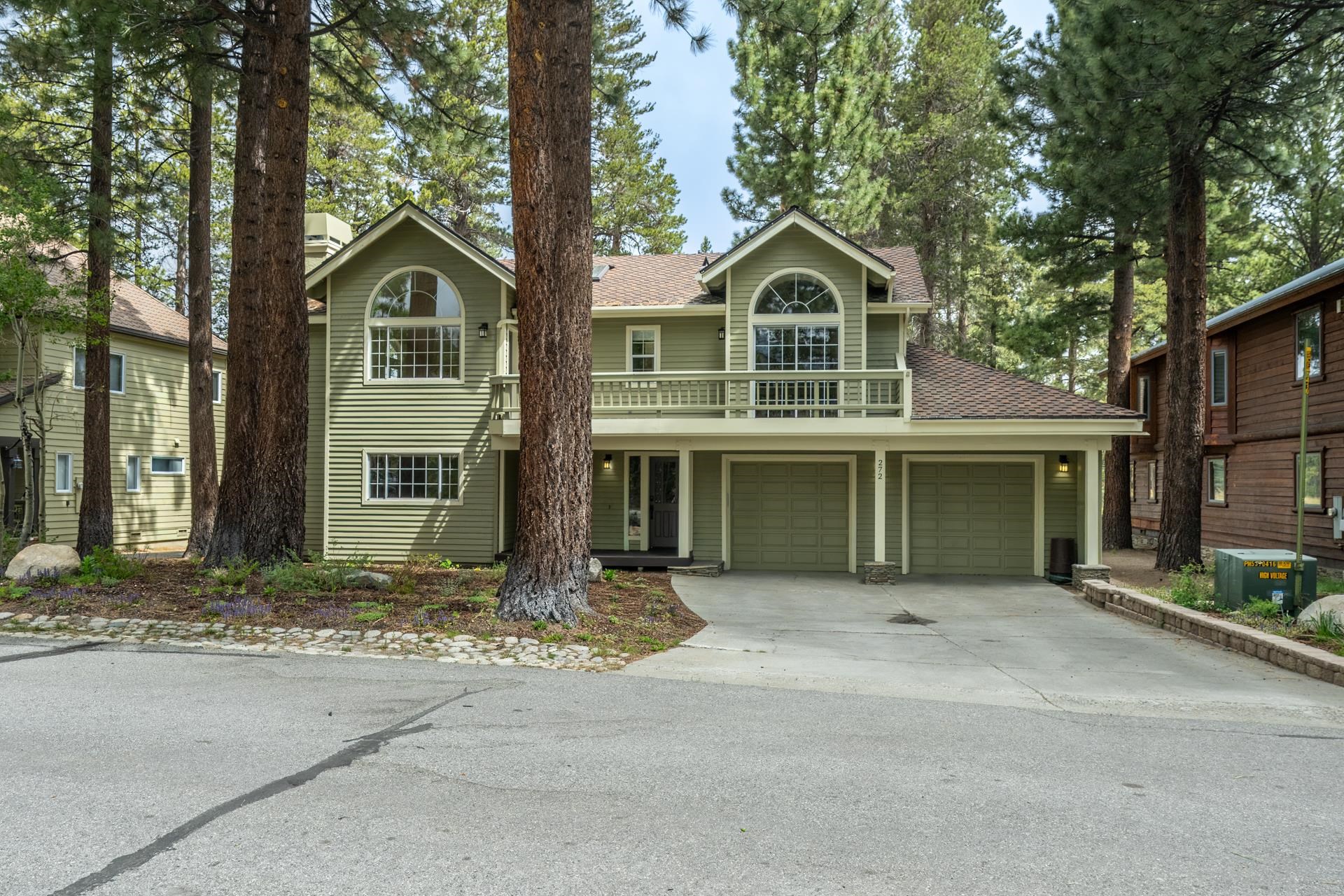 272 Ridge Way Mammoth Lakes, CA 93546 - Photo 47 of 55 Green siding exterior with a two-car garage
