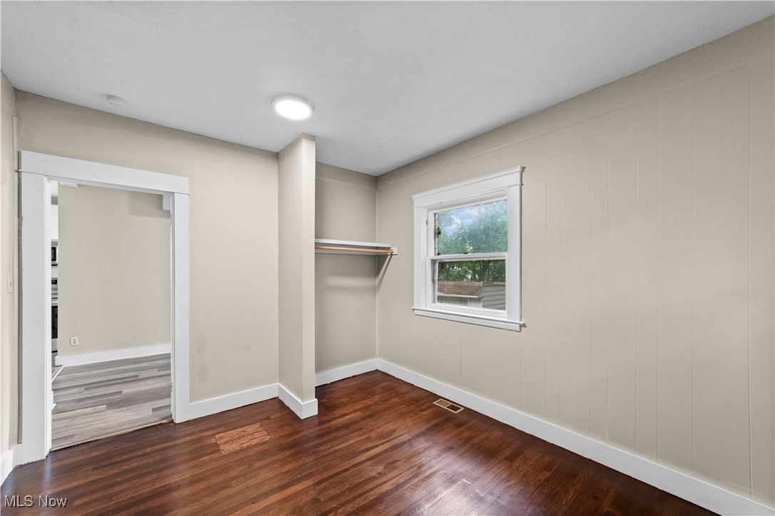 3165 Oak Road Cleveland, OH 44118 - Photo 18 of 30 Unfurnished bedroom with dark wood-style flooring and a closet