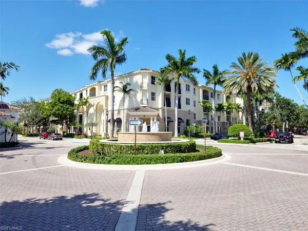 a picture of palm trees in front of house