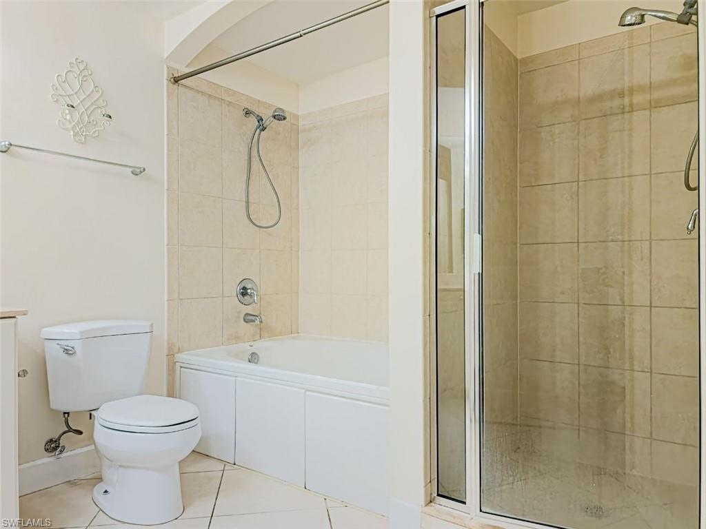 1312 Renaissance Way, Unit 312 Boynton Beach, FL 33426 - Photo 13 of 23 a bathroom with a toilet a sink and shower