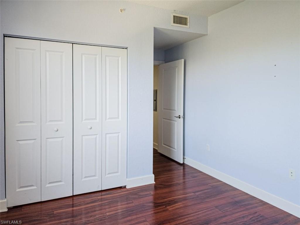 1312 Renaissance Way, Unit 312 Boynton Beach, FL 33426 - Photo 19 of 23 a view of an empty room with wooden floor