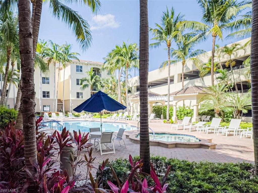 1312 Renaissance Way, Unit 312 Boynton Beach, FL 33426 - Photo 2 of 23 a street view with tall buildings and a street sign
