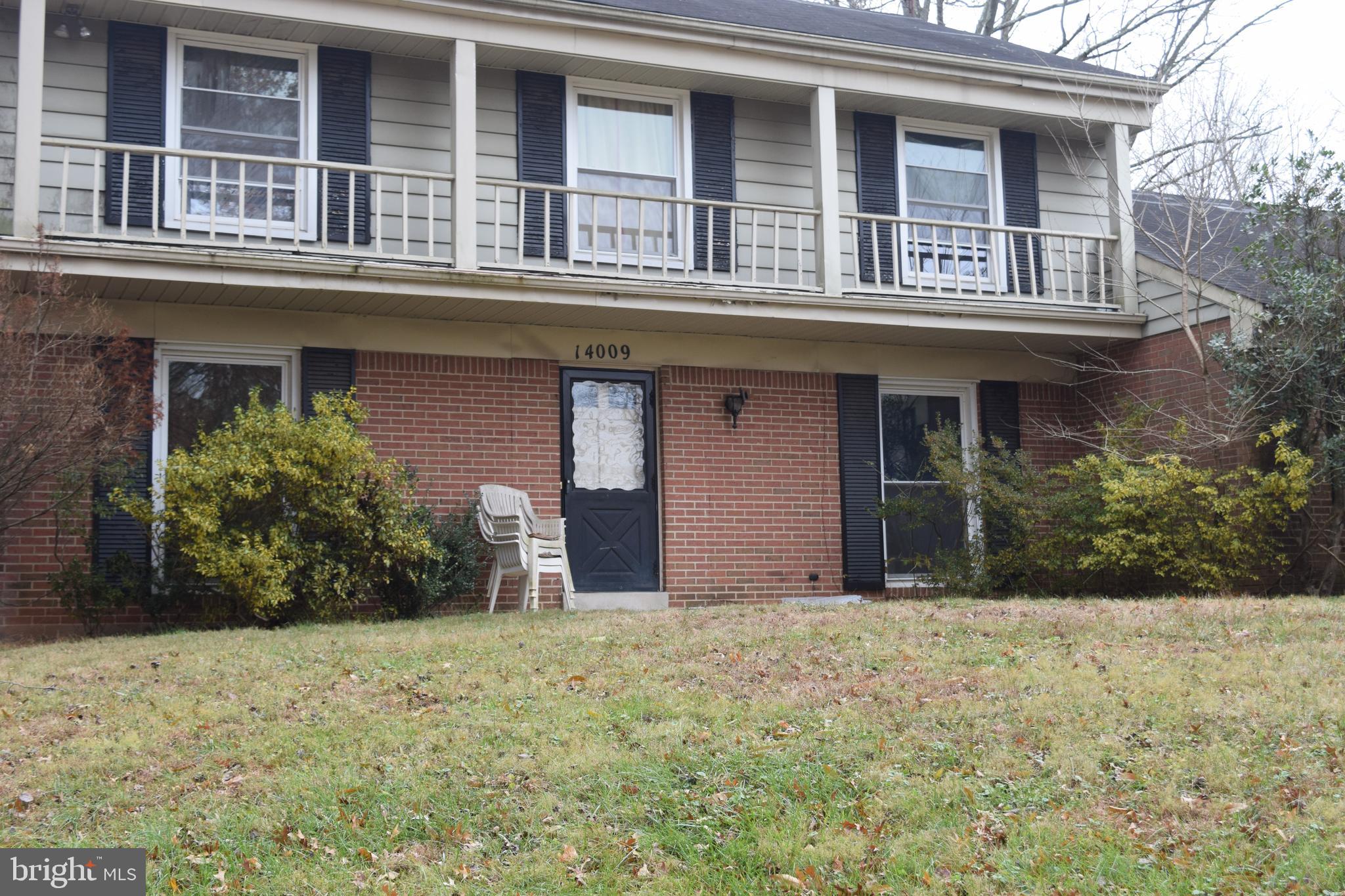 14009 Pond View Road Silver Spring, MD 20905 - Photo 3 of 11 a view of a house with large windows and a yard