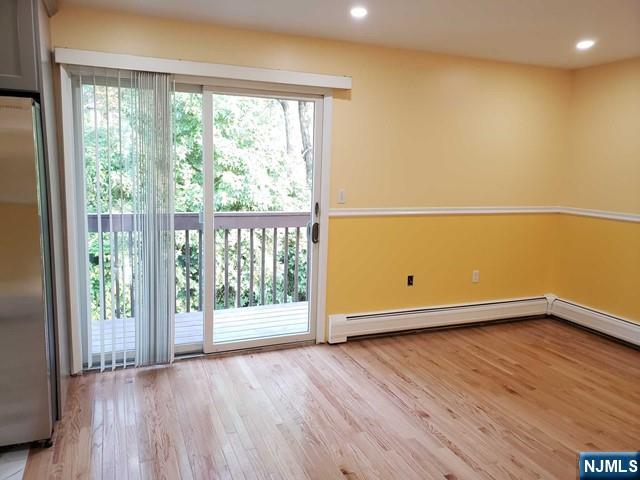 478 Walnut Street Ridgefield, NJ 07657 - Photo 12 of 26 a view of an empty room with wooden floor and a window