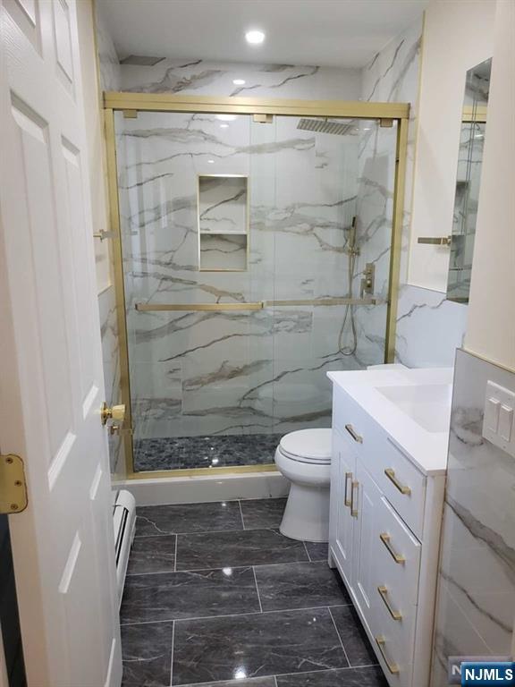 478 Walnut Street Ridgefield, NJ 07657 - Photo 16 of 26 a bathroom with a granite countertop shower toilet and sink