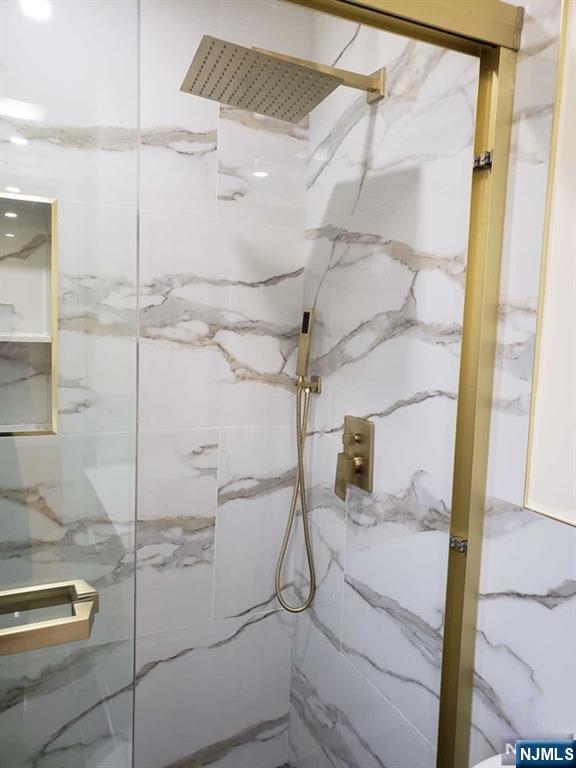 478 Walnut Street Ridgefield, NJ 07657 - Photo 18 of 26 a bathroom with a shower