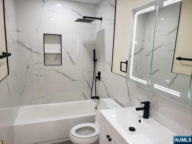478 Walnut Street Ridgefield, NJ 07657 - Photo 22 of 26 a bathroom with a sink a toilet and a bathtub