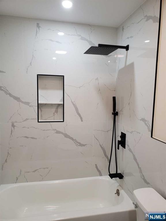 478 Walnut Street Ridgefield, NJ 07657 - Photo 23 of 26 a bathroom with a sink a toilet and a bathtub