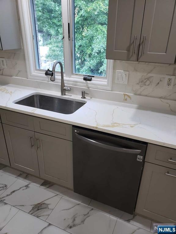 478 Walnut Street Ridgefield, NJ 07657 - Photo 7 of 26 a kitchen with a sink and cabinets