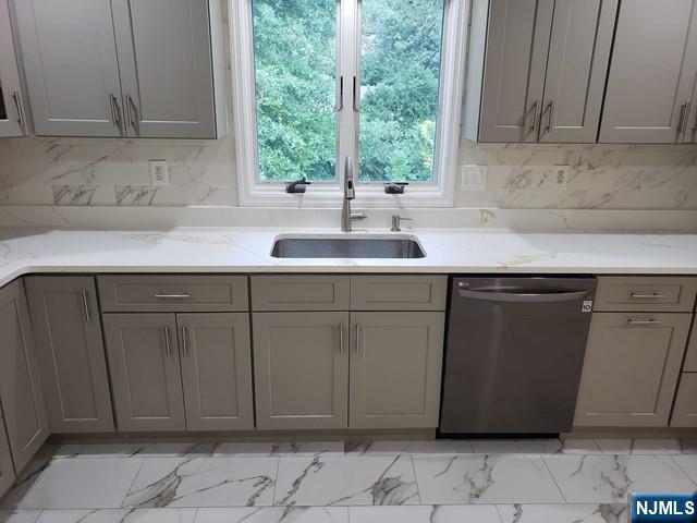 478 Walnut Street Ridgefield, NJ 07657 - Photo 9 of 26 a kitchen with a sink and cabinets