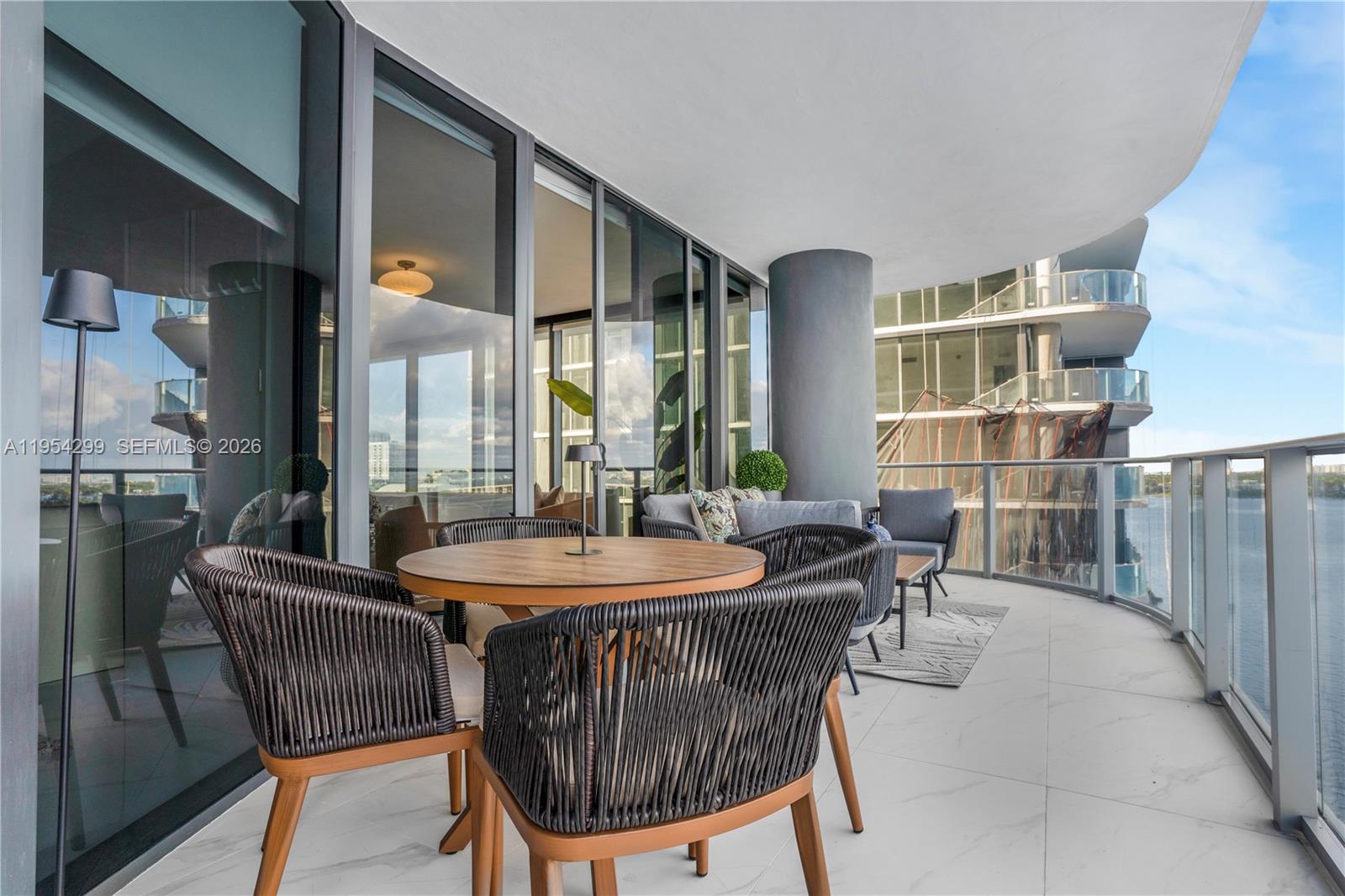 700 Northeast 24th Street, Unit 901 Miami, FL 33137 - Photo 15 of 59 a dining room with furniture and window
